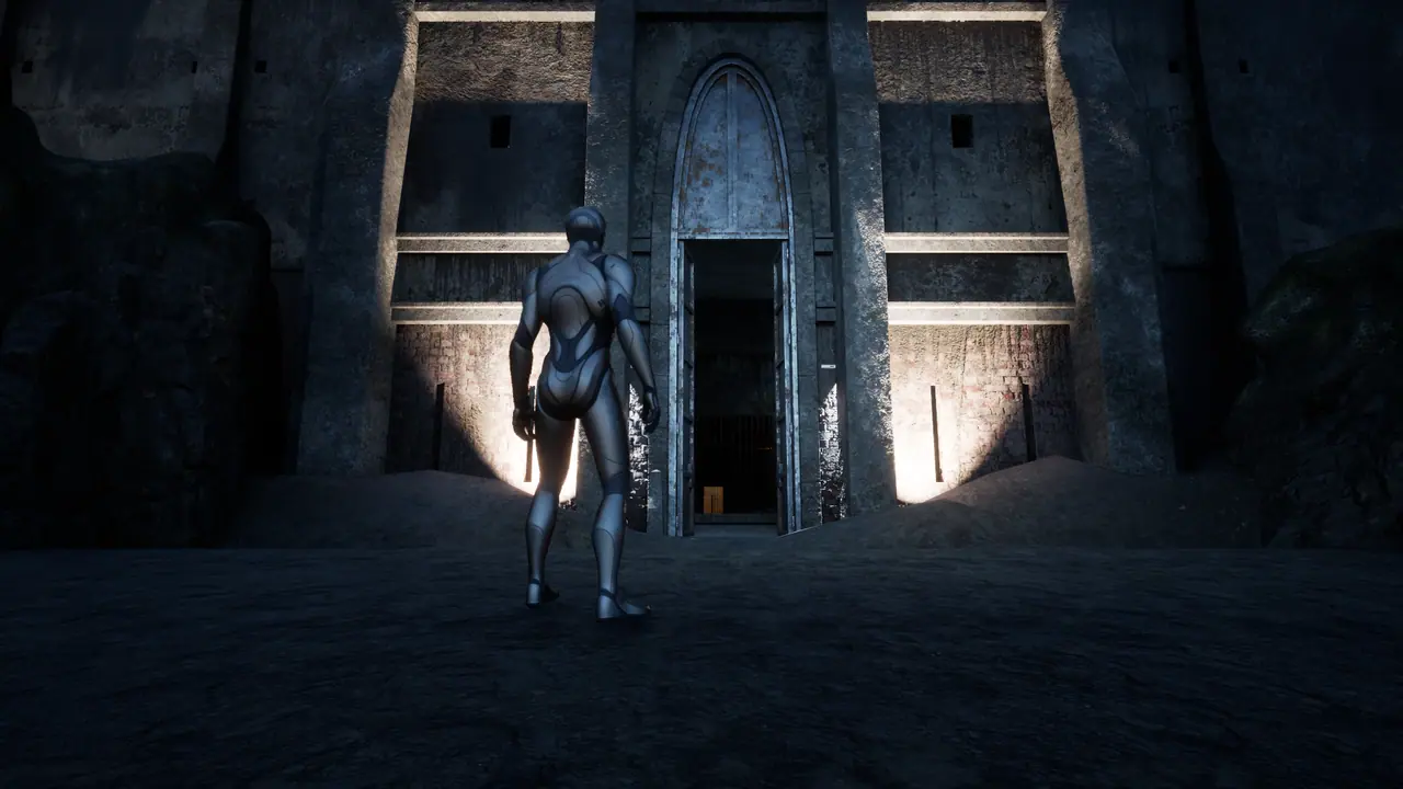 A grey placeholder mannequin walks toward the lit arched main gate of the prison at night.