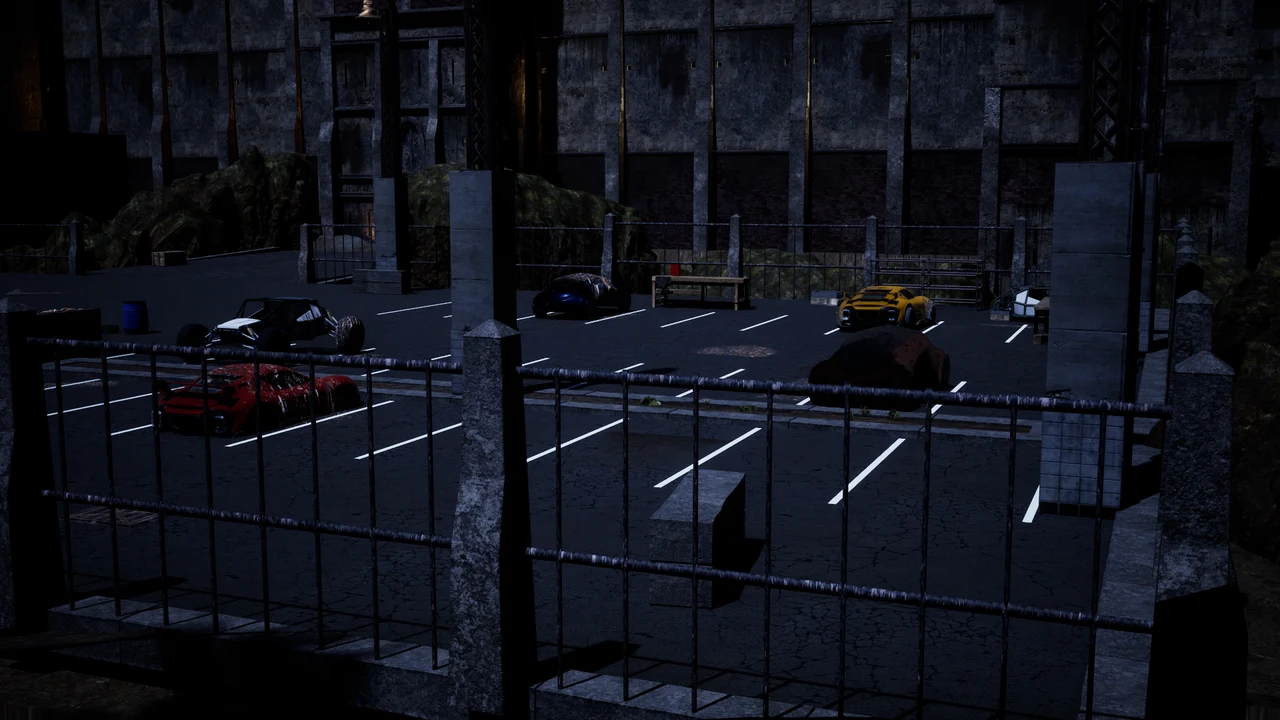 The prison parking lot viewed through its perimeter fence.